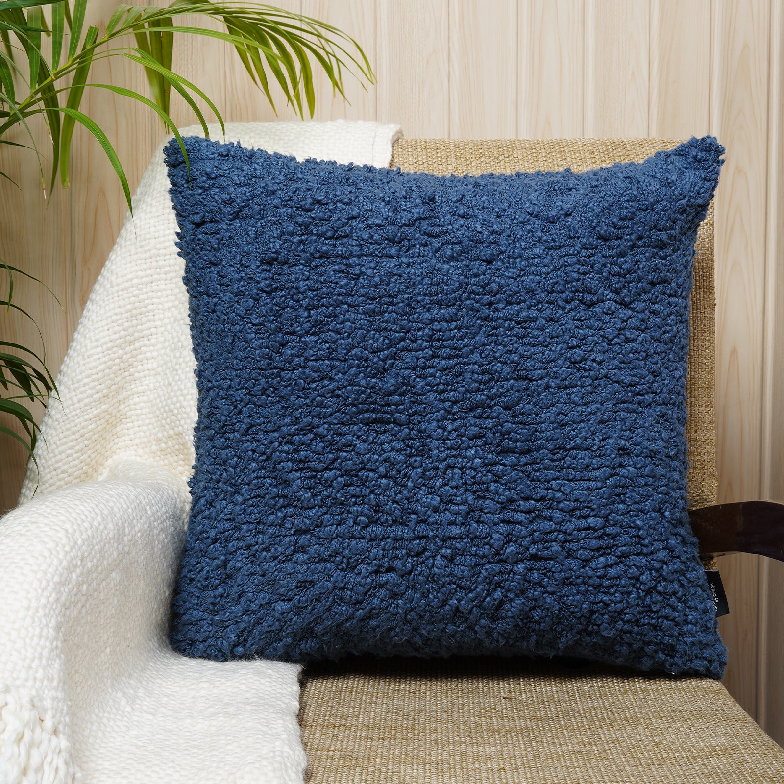 Plush cotton cushion in bold azure blue with rich texture - ideal for sofas and accent chairs